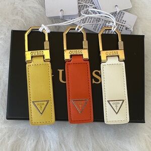 New GUESS Keychain Trio in Yellow, Orange, and Cream